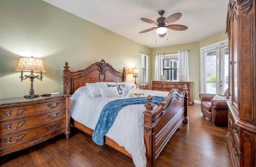 a bedroom with a bed and a ceiling fan at Surfside in Cape Coral