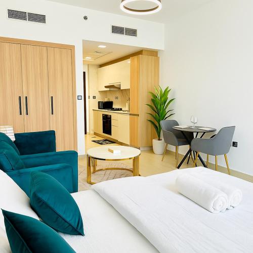 a bedroom with a bed and a living room at Stunning Studio in Dubai in Dubai