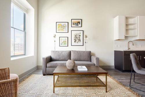 a living room with a couch and a coffee table at Kasa Altmayer Savannah in Savannah