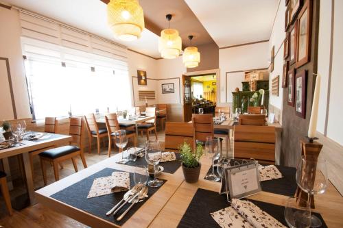 a dining room with a table and chairs at Gostilna in motel Pri Lešniku in Maribor