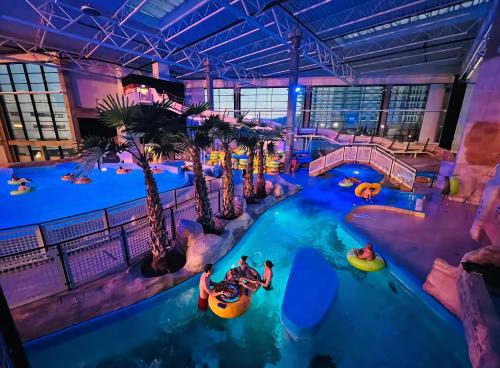 an indoor water park with people in tubes at Leśna Przystań Rumia - obok Gdyni i Aquaparku Reda in Rumia