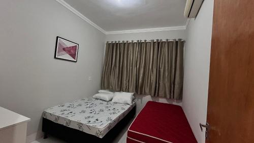 En eller flere senge i et værelse på Casa Recanto Ville