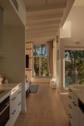 a large kitchen with a large window and a large room at Oceano House in Copacabana