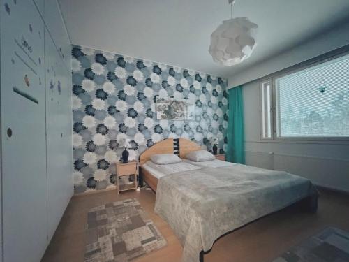 En eller flere senge i et værelse på Northern Seasons - Outokumpu