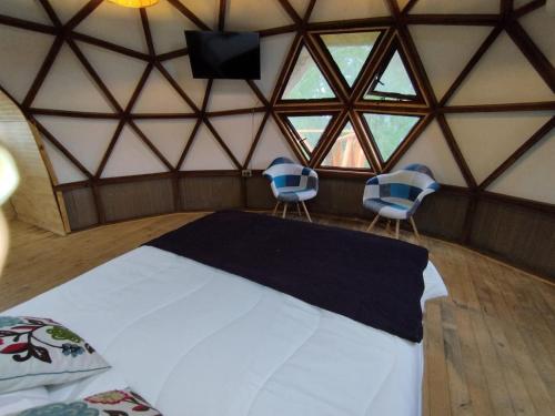 Postel nebo postele na pokoji v ubytování Hostal y Domos Bello Horizonte