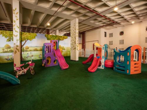 a room with a play area with a playground at Orange Suites Hotel in Manama