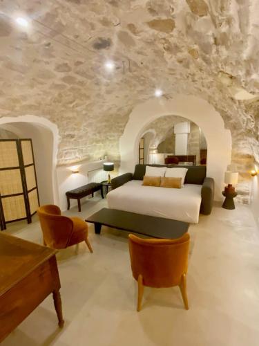 a bedroom with a king sized bed and a piano at Exceptional Apartment Île Saint Louis - Jacuzzi in Paris