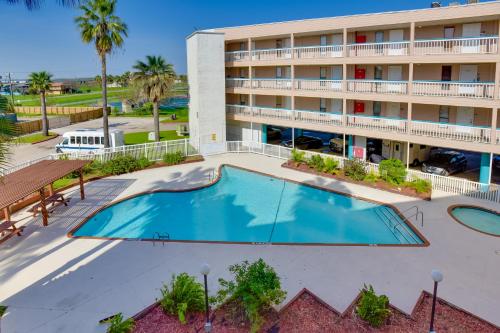 an overhead view of the pool in front of a hotel at Steps to Water! Beachfront Corpus Christi Condo in Corpus Christi