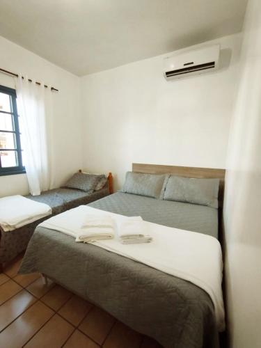 Ένα ή περισσότερα κρεβάτια σε δωμάτιο στο Pousada Del Mare