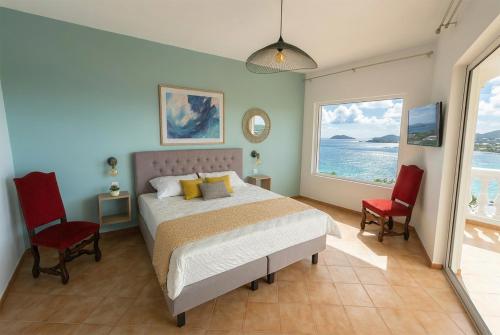 Ένα ή περισσότερα κρεβάτια σε δωμάτιο στο Pearl of Paradise