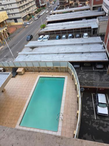 a swimming pool on top of a building at The Oceanic 42 in Durban