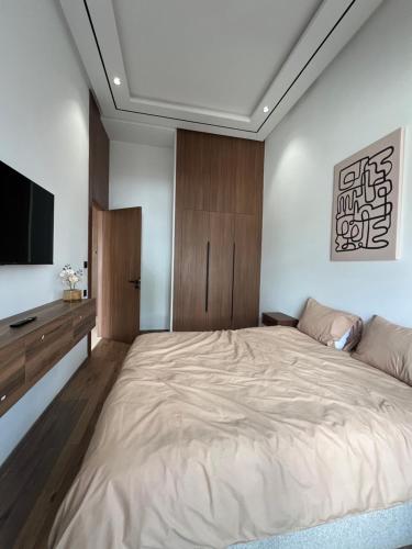 En eller flere senge i et værelse på A Suites