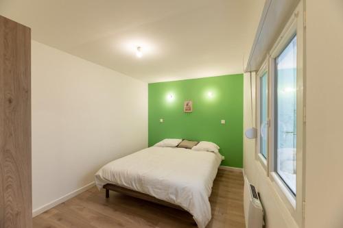 Llit o llits en una habitació de Le Vert Calme