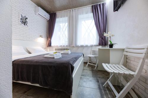 Postel nebo postele na pokoji v ubytování Smart Hotel Rooms near metro 24/7