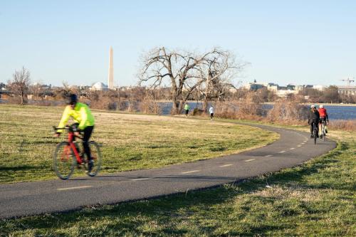 a group of people riding bikes on a bike path at Kasa Alexandria Washington in Alexandria