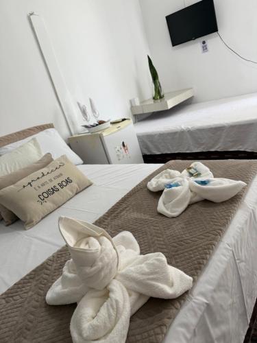 En eller flere senge i et værelse på Pousada Canto das Lagoas