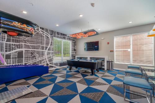 a game room with a ping pong table and a pool table at Kasa Downtown Des Moines in Des Moines