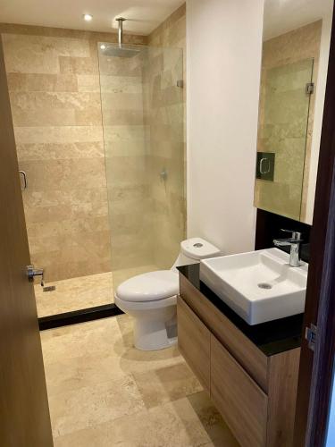 a bathroom with a toilet and a sink and a shower at #1 in Andares Pool-Jacuzzi-We invoice free of charge in Guadalajara