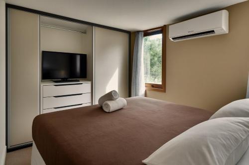 En eller flere senge i et værelse på Casa Bonfim - Excelente opção no centro de Arraial