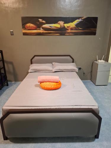 a bed with two pillows on it in a room at The Baluarte in Maasin