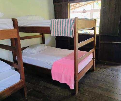 a group of bunk beds in a room at Lunaria Pacífico in El Valle
