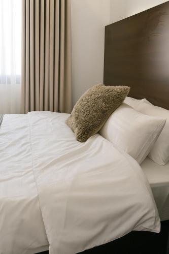 Ένα ή περισσότερα κρεβάτια σε δωμάτιο στο تيوليب للشقق الفندقية - Self entry