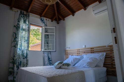 En eller flere senge i et værelse på Casa Naya