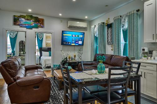 a living room with a couch and a table at Top Floor with Skylight Brooklyn in Brooklyn