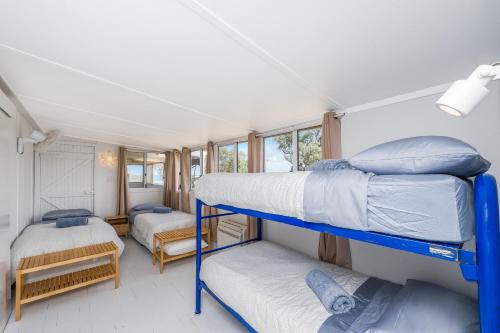 a room with two bunk beds in a house at Love You Moore in Guilderton