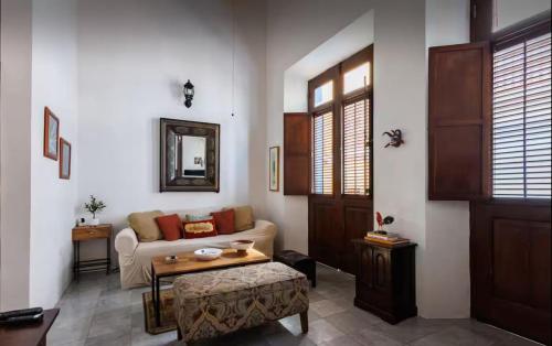 a living room with a couch and a table at Stylish Old San Juan 1 Br, 1 Bath, Loft Condo! in San Juan