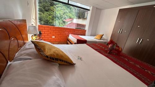 En eller flere senge i et værelse på All sur departamento