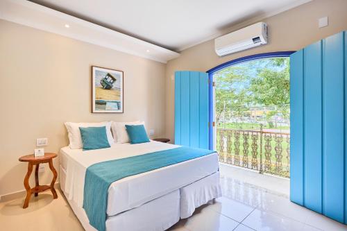 Postel nebo postele na pokoji v ubytování Pousada Eclipse Paraty