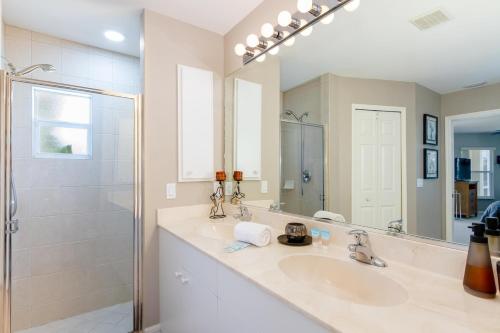 a bathroom with a sink and a shower at Alecia in Cape Coral