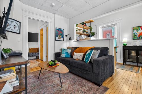 a living room with a couch and a table at Charming 1BR Steps from Church Street - Downtown in Burlington