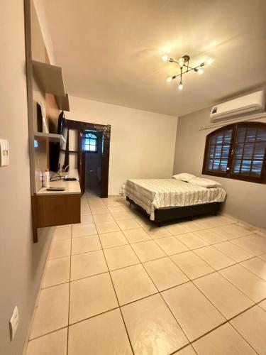 En eller flere senge i et værelse på Casa Dois Amores - Espaço, Lazer e Natureza