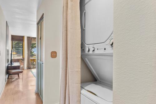 a kitchen with a sink and a dishwasher at The Landing at Kailua Bay in Kailua-Kona