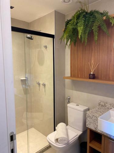 a bathroom with a shower and a toilet and a sink at Studio beach class Meireles in Fortaleza