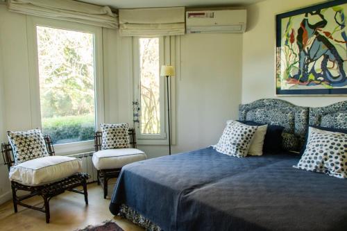 Postel nebo postele na pokoji v ubytování Quimera Lodge