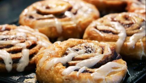 a bunch of donuts with icing on a tray at Holiday Inn Express - Santa Rosa North by IHG in Santa Rosa