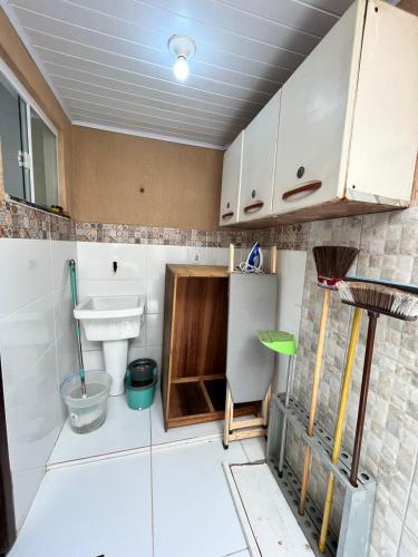 a small bathroom with a sink and a toilet at Duplex em Itaúna 4min da Praia que ocorre o WSL, 1min da pista de skate do LS, pracinha com parque infantil, quadra de futebol, tudo isso a 1 min da duplex, perto do comércio, wi-fi super rápido, monitoramento 24hrs in Saquarema