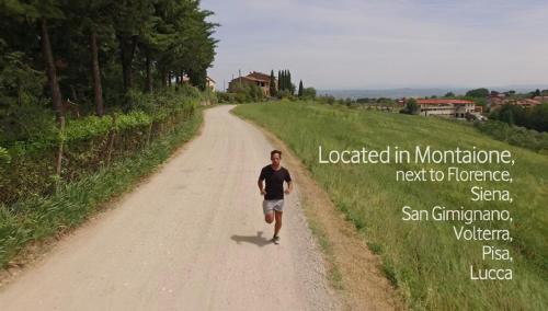 a man walking down a dirt road at Borgo La Casaccia in Montaione