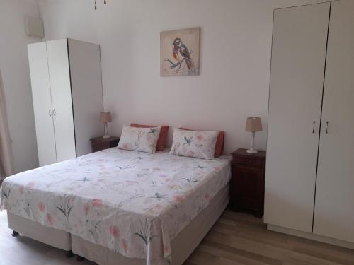 En eller flere senge i et værelse på Do-Little Farm Cottages