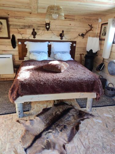 Letto o letti in una camera di La Cabane du Trappeur