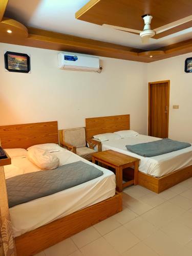 Ένα ή περισσότερα κρεβάτια σε δωμάτιο στο Hotel Dhanmondi