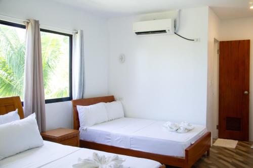 Ένα ή περισσότερα κρεβάτια σε δωμάτιο στο ARNOLD'S HOTEL