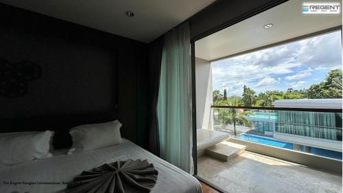 Postel nebo postele na pokoji v ubytování The Regent Phuket Bangtao Beach