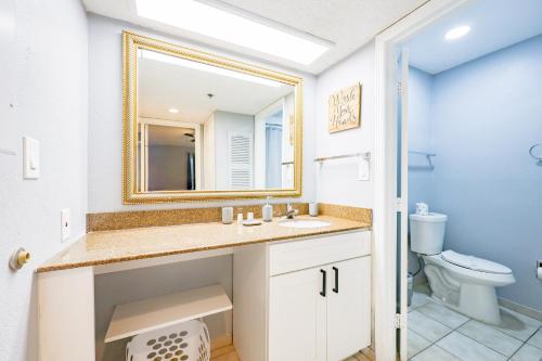 a bathroom with a sink and a mirror at Disney Universal Family Resort # Pool # Gym in Orlando