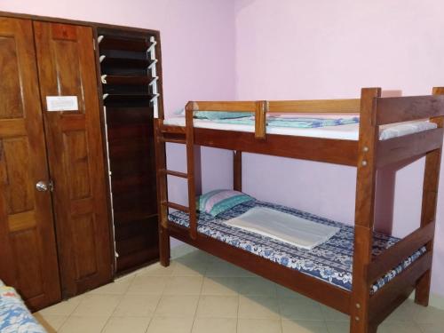 Postel nebo postele na pokoji v ubytování Bluepango Guest House
