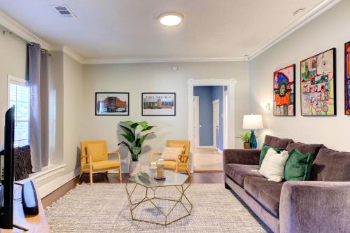 a living room with a couch and a table at Spacious 3BR Midtown Home - Sleeps 7 - Walkable to Dining & Attractions - Easy Access to Downtown in Memphis
