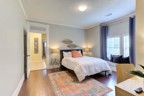 a bedroom with a bed and a living room at Spacious 3BR Midtown Home - Sleeps 7 - Walkable to Dining & Attractions - Easy Access to Downtown in Memphis
